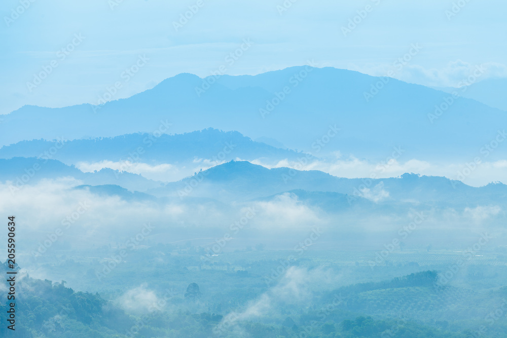 slow floating fog blowing cover on the top of mountain in Khao Kai Nui Phang Nga province look like as a sea of mist