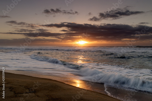 Sunrise on Diamond Beach  long sandy beach with waves