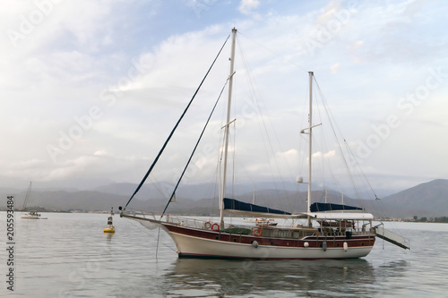 Billede på lærred Two-masted sailboat in the harbor of  Fethiye, Turkey