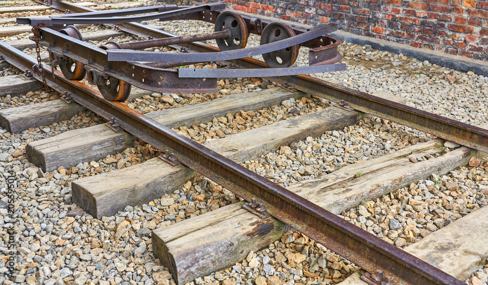 Fototapeta premium Old rusty delapidated railroad cart on a track