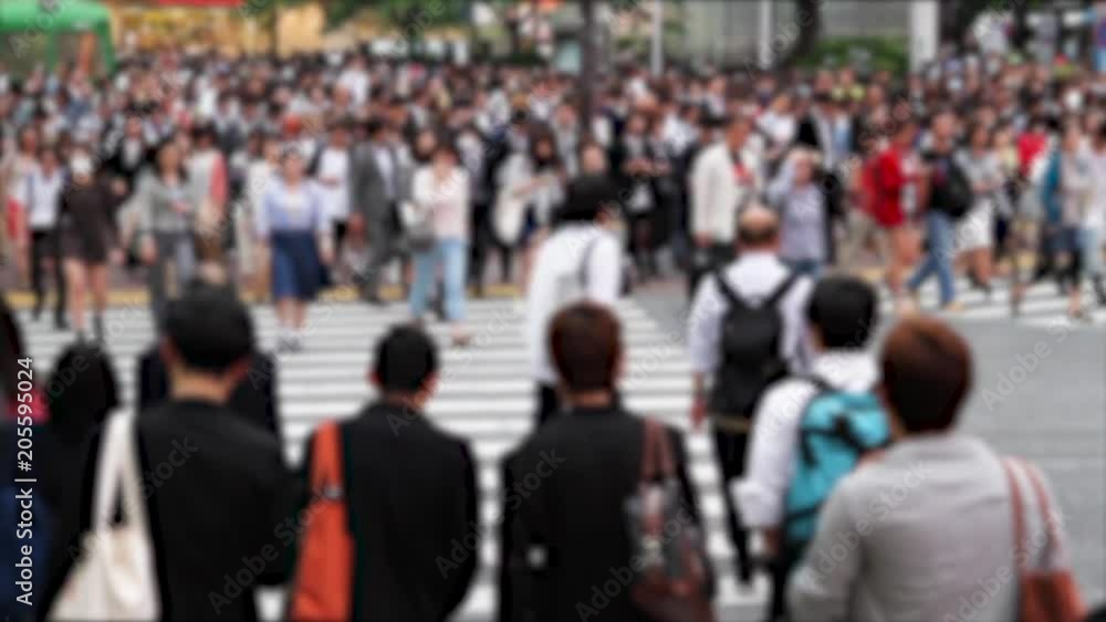 Blurred video of people walking the Shibuya crossing, probably the busiest pedestrian crossing in the world, Tokyo, Japan Blurred video of people walking the Shibuya crossing, probably the busiest pedestrian crossing in the world, Tokyo, Japan