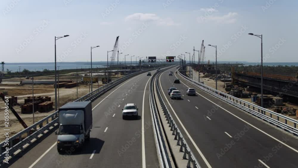 KERCH, RUSSIA, May 16, 2018: Aerial view of The Crimean Bridge, Kerch Bridge, colloquially the Kerch Strait Bridge with road and rail passages across the Kerch Strait, which will connect the Taman KERCH, RUSSIA, May 16, 2018: Aerial view of The Crimean Bridge, Kerch Bridge, colloquially the Kerch Strait Bridge with road and rail passages across the Kerch Strait, which will connect the Taman