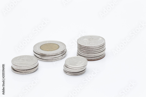 Pile of Canadian Dollar coins in a white background