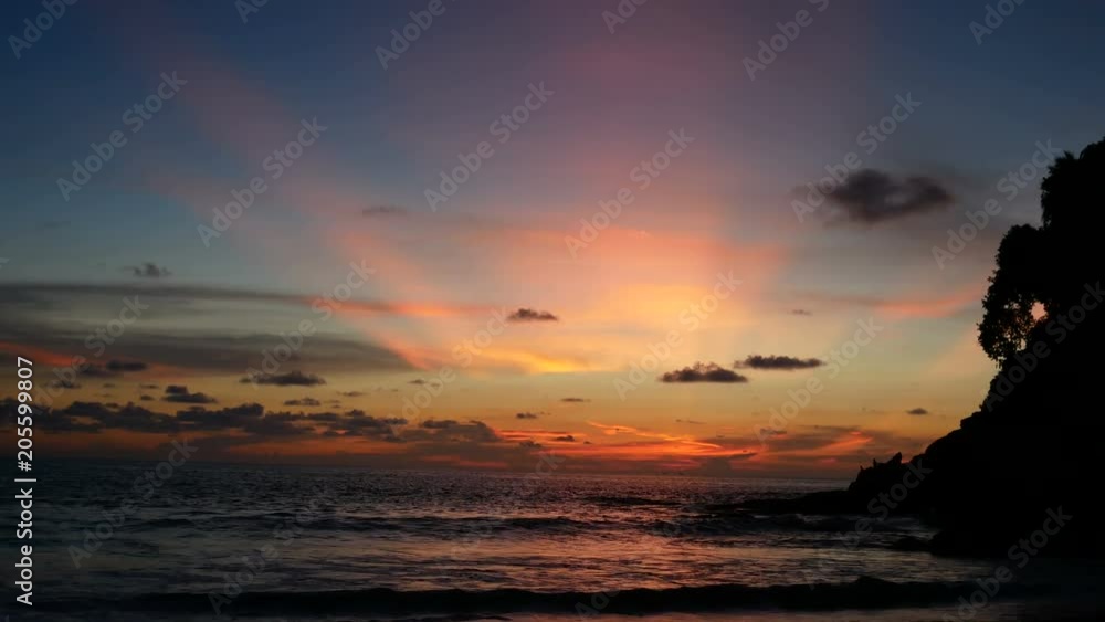 colorful golden blue sunbeam twilight cloudy sky after sunset in ocean sea Surin beach at Phuket southern Thailand. Waves hit silhouette rock and sandy beach. Silhouette tree plant.
colorful golden blue sunbeam twilight cloudy sky after sunset in ocean sea Surin beach at Phuket southern Thailand. Waves hit silhouette rock and sandy beach. Silhouette tree plant.