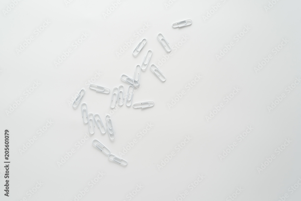 White paper clips isolated on white background