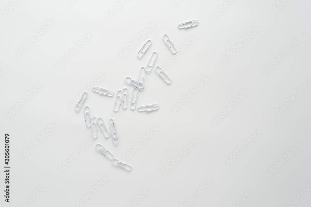 White paper clips isolated on white background White paper clips isolated on white background