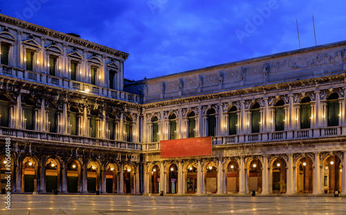 The picturesque National Library of St Mark's and Museo Correr on Piazza St Marco or Saint Mark's square at sunrise in Venice Italy photo