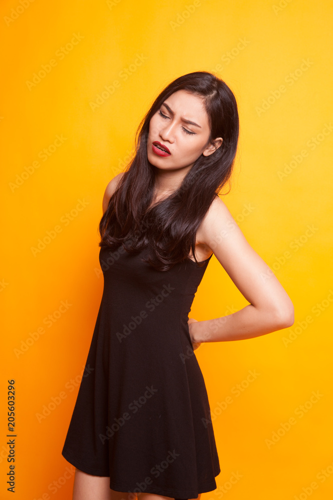 Young Asian woman got back pain. Young Asian woman got back pain.