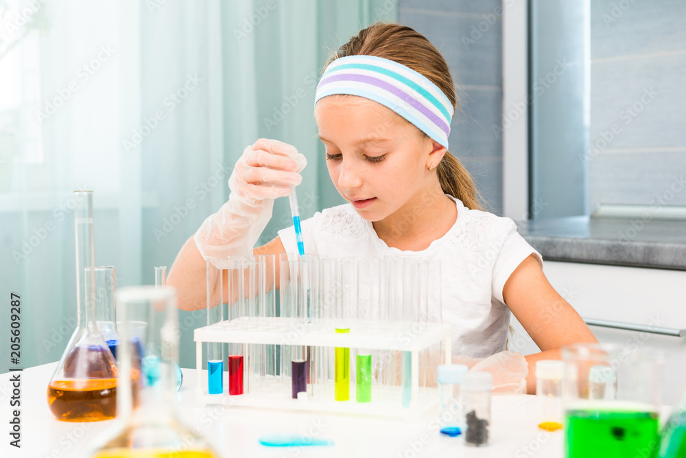 little girl with flasks for chemistry little girl with flasks for chemistry