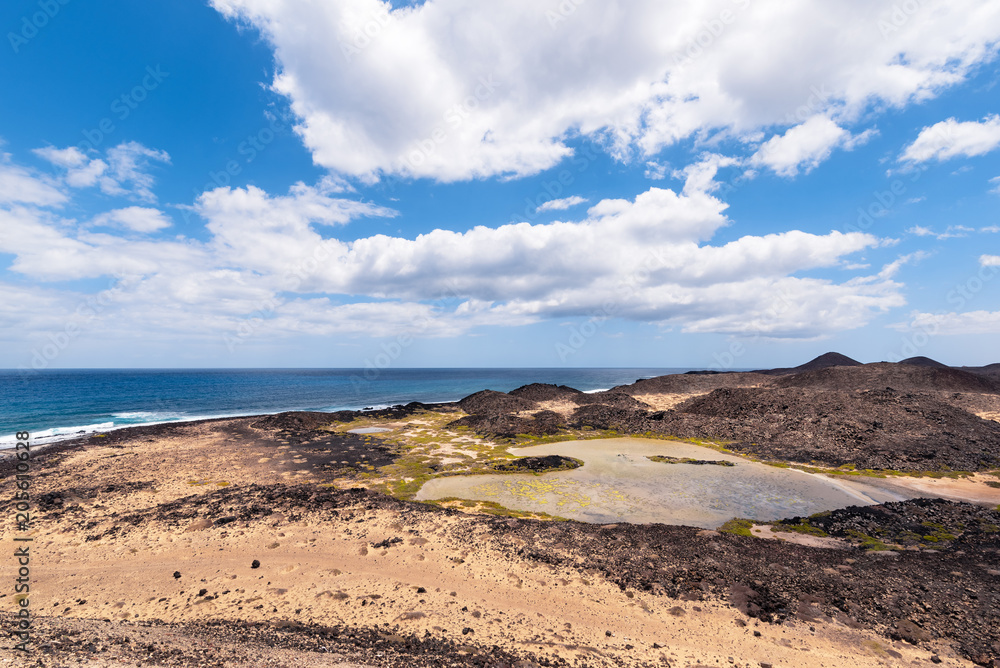 view of the brackish water lagoon that forms near the lighthouse of the island of Lobos in Fuerteventura, Spain