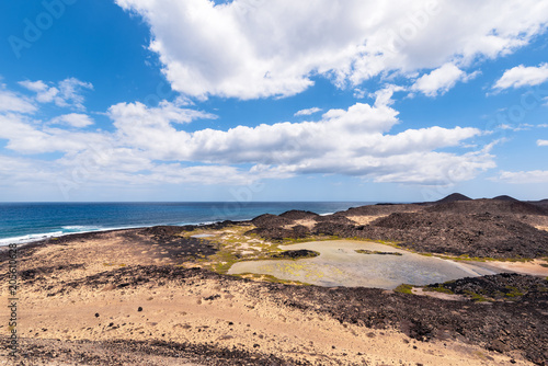 view of the brackish water lagoon that forms near the lighthouse of the island of Lobos in Fuerteventura, Spain