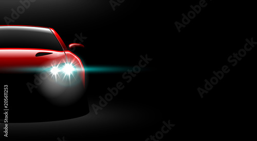 realistic red sport car view with unlocked headlights in the dark