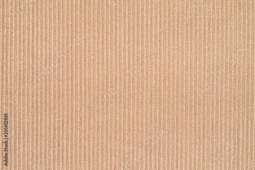 Corduroy background in close up. Texture of orange corduroy textile - useful as background  photo
