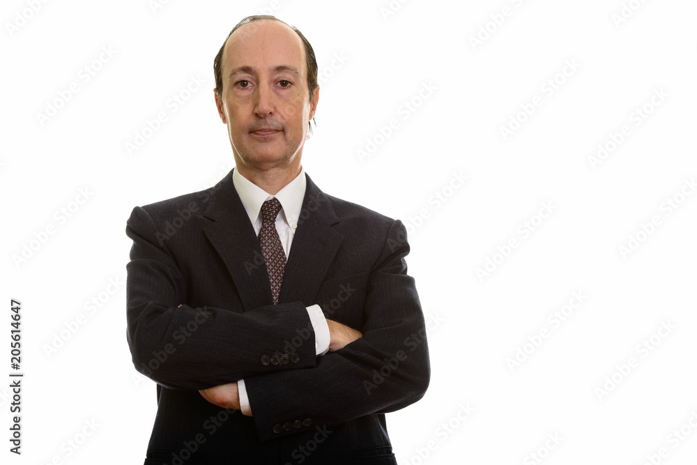 Studio shot of mature businessman with arms crossed Studio shot of mature businessman with arms crossed