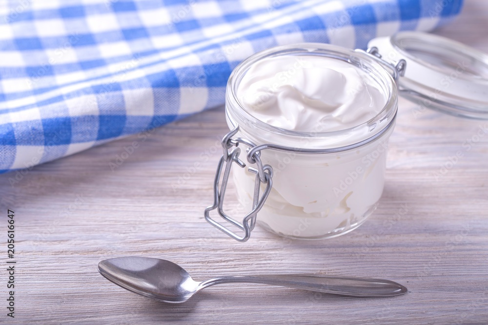 Sour cream in a glass jar. Homemade sour cream Sour cream in a glass jar. Homemade sour cream