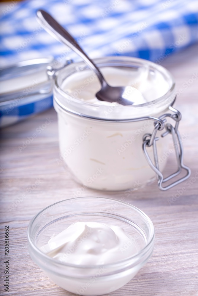 Homemade sour cream . Sour cream in a glass bowl Homemade sour cream . Sour cream in a glass bowl