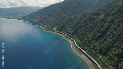 Aerial view of Patapat viaduct in the coast of Pagudpud, Ilocos Norte. Highway with bridge by coast sea near the mountains. Philippines, Luzon. Highway along the coast. © Alex Traveler