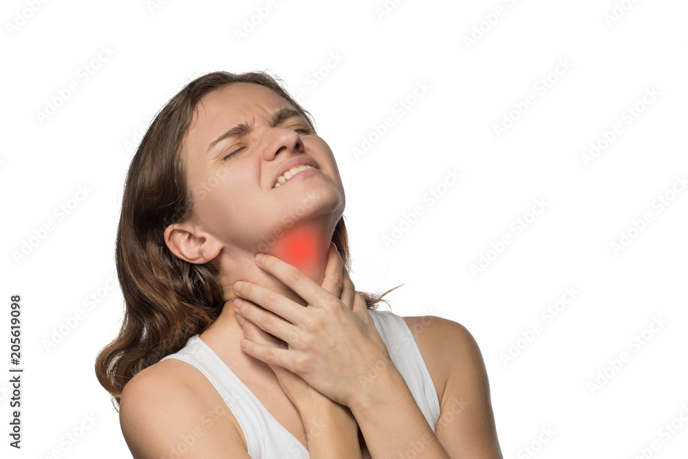 Beautiful woman holding her neck, because she hurts against a white background Beautiful woman holding her neck, because she hurts against a white background