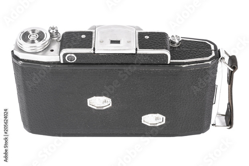 Old, antique pocket camera. The black camera is covered with a black leather handle. Front view on a white background photo