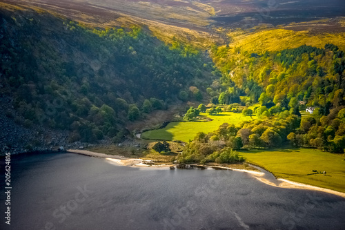 Picturesque green landscape of Lough Tay lake at Luggala,Wicklow mountains, Ireland. Aerial, panoramic view photo