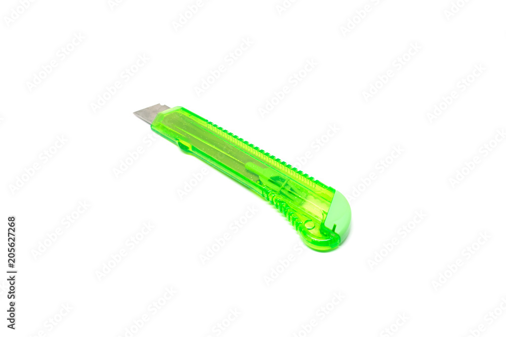 Green paper cutter knife isolated on white background Green paper cutter knife isolated on white background