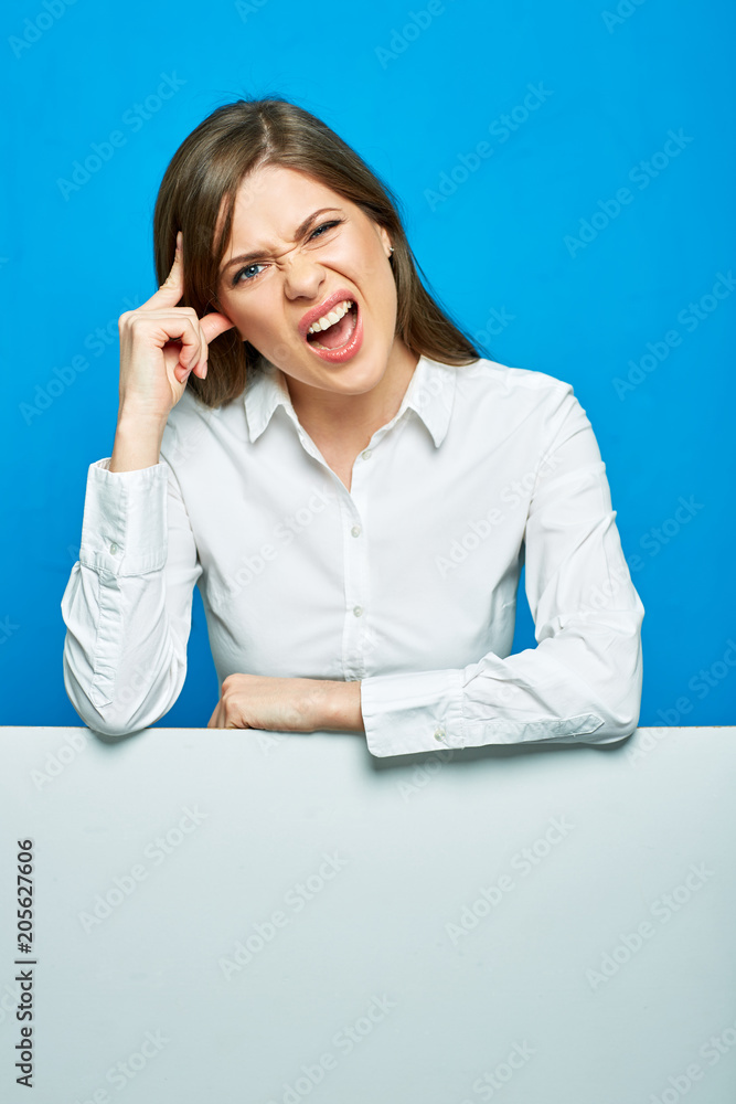 Hater woman with negative emotion studio portrait on blue. Hater woman with negative emotion studio portrait on blue.