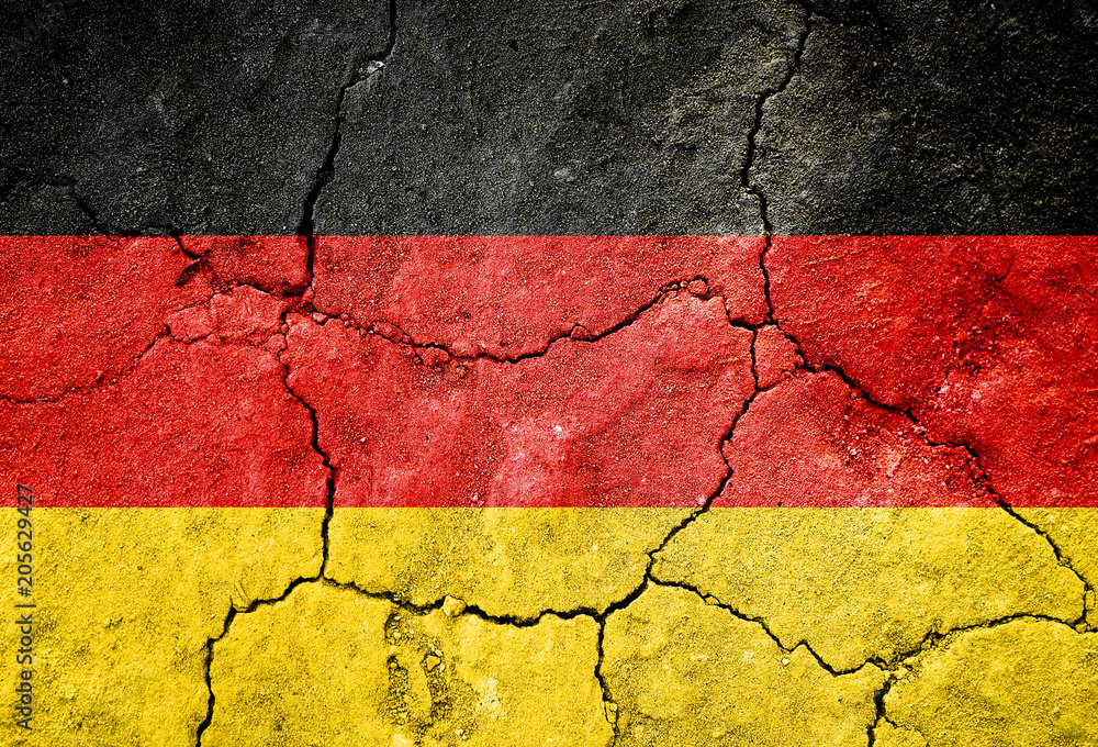 Grunge Flag of Germany on cracked surface as background