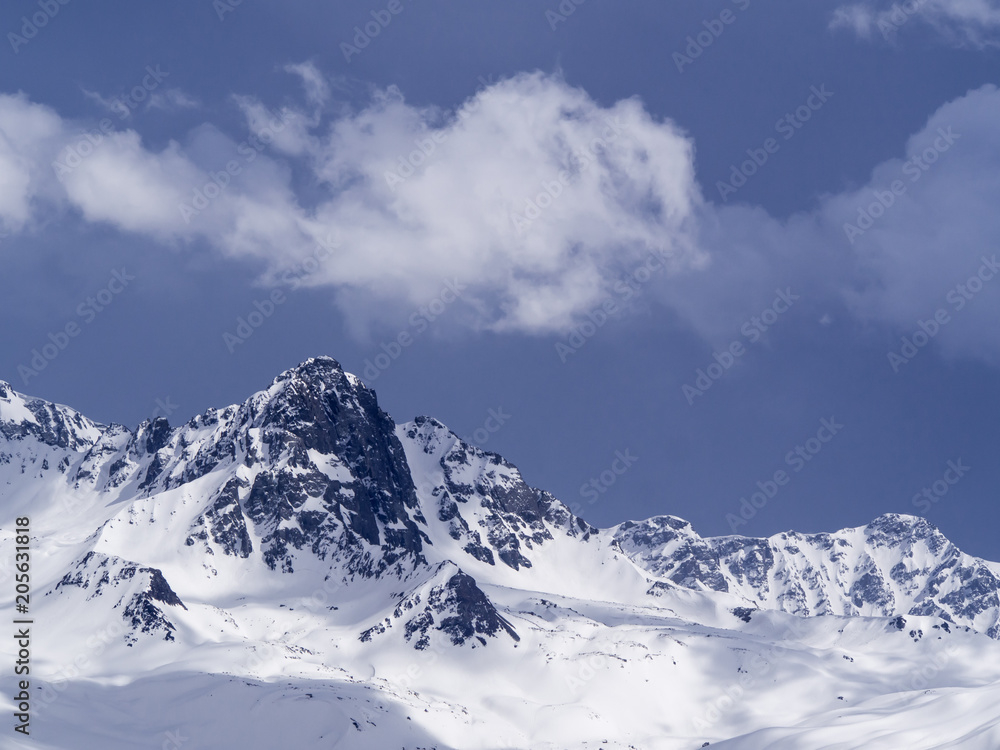 the snow on the top of mountain with blue sky background