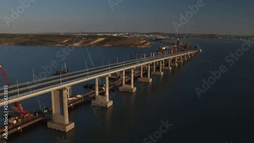 KERCH, RUSSIA, May 16, 2018: Aerial view of The Crimean Bridge, Kerch Bridge, colloquially the Kerch Strait Bridge with road and rail passages across the Kerch Strait, which will connect the Taman photo