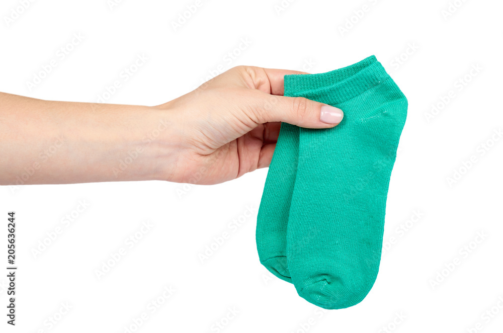 Cotton kid sock with hand isolated on white background Cotton kid sock with hand isolated on white background