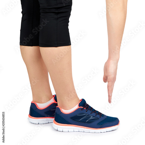 Fit female leg in sport shoe isolated on white background