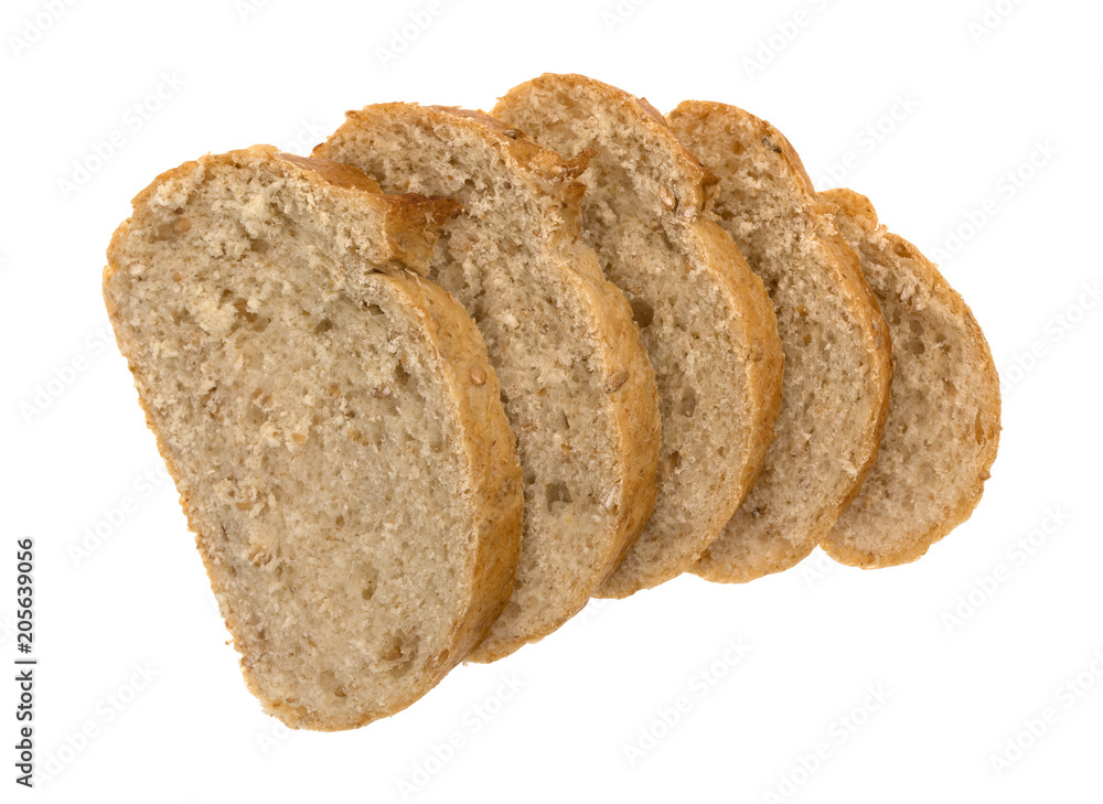 Top view of several slices of whole wheat bread loaf isolated on a white background.