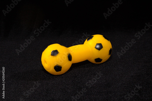 Toys for pets dog and cat. Rubber and textile accessories on dark background