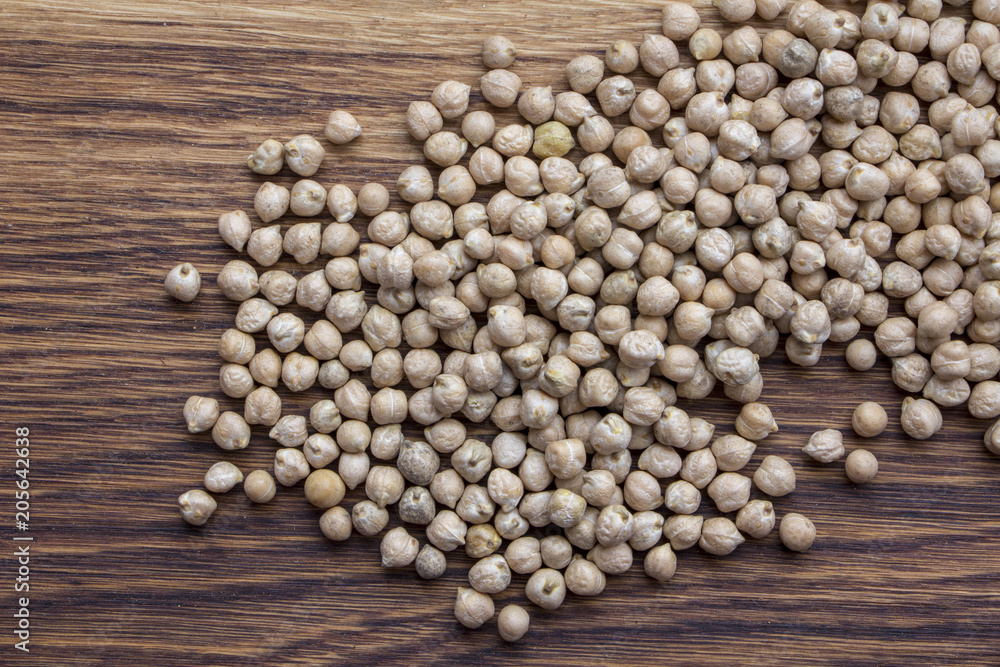 raw organic chickpeas in a wooden plate Natural organic bean raw organic chickpeas in a wooden plate Natural organic bean