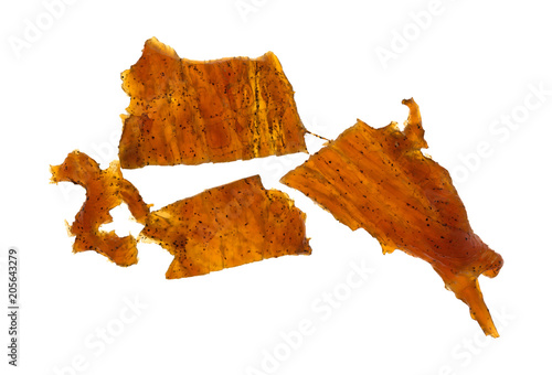 Pieces of turkey jerky isolated on a white background.