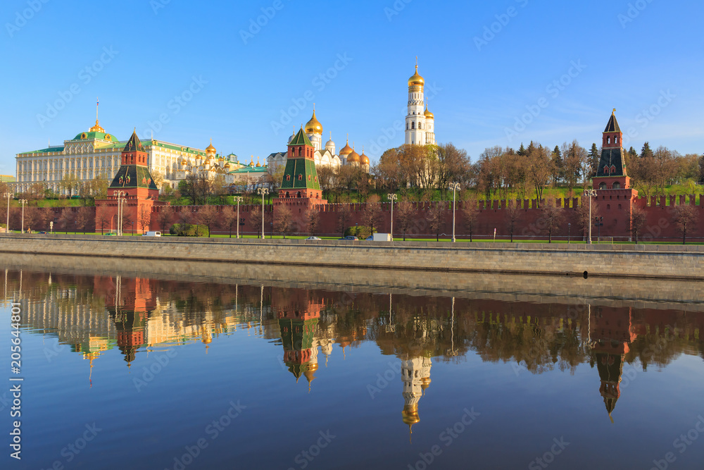 Kremlevskaya embankment on the background of Moscow Kremlin on a sunny spring morning Kremlevskaya embankment on the background of Moscow Kremlin on a sunny spring morning