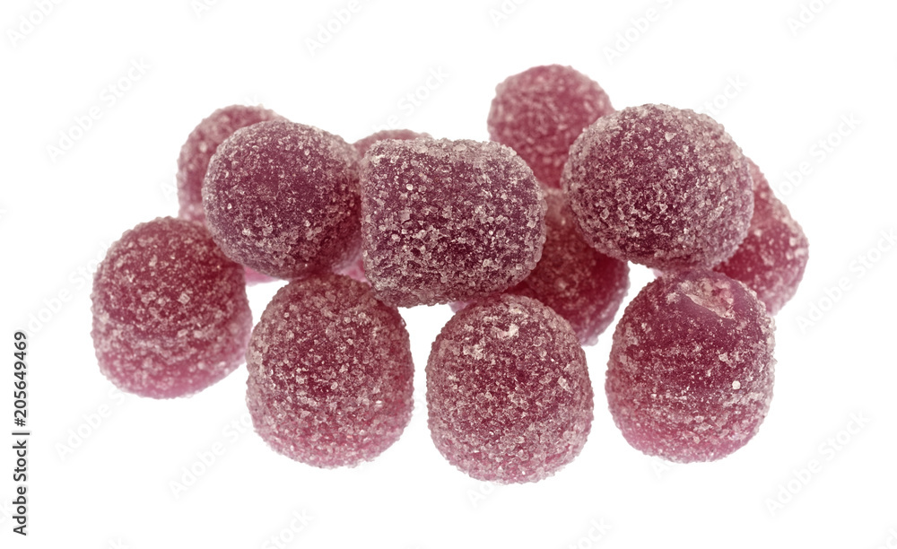 Sugar coated grape sour drop gummy candy isolated on a white background. Sugar coated grape sour drop gummy candy isolated on a white background.
