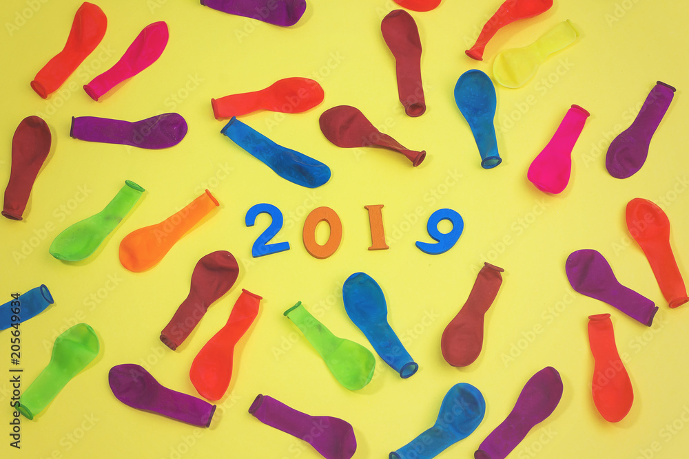 colorful wooden numbers forming the number 2019 with ballons , For the new year 2019