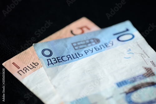 Two Belarusian banknotes on a dark background close up
