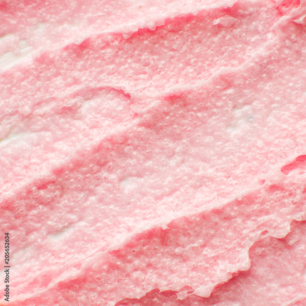 Texture cosmetic scrub for face and body pink sugar. Selective focus, trendy punchy pastel background Texture cosmetic scrub for face and body pink sugar. Selective focus, trendy punchy pastel background