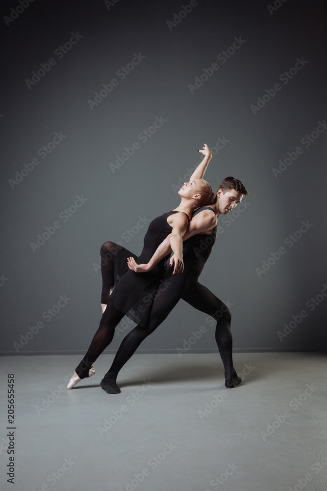 Young pretty ballerina dancing and leaning on her partner. Young pretty ballerina dancing and leaning on her partner.