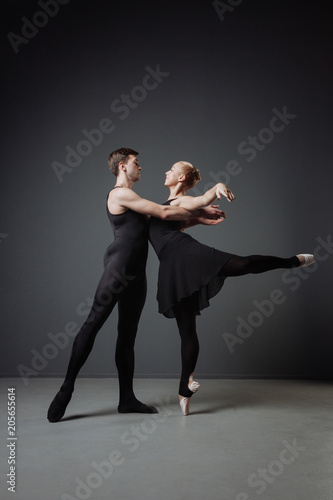 Beautiful cute couple of dancers training and moving graceful.