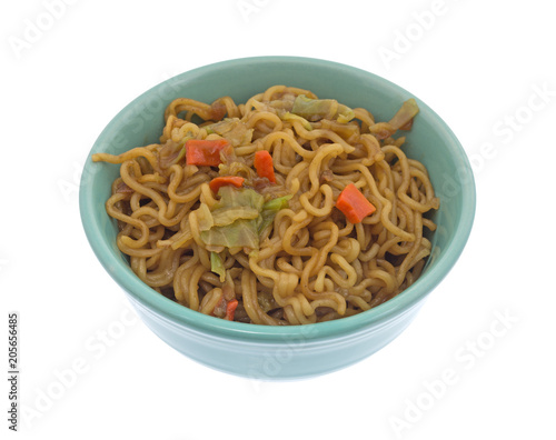 Beef flavored ramen noodles in a bowl isolated on a white background.