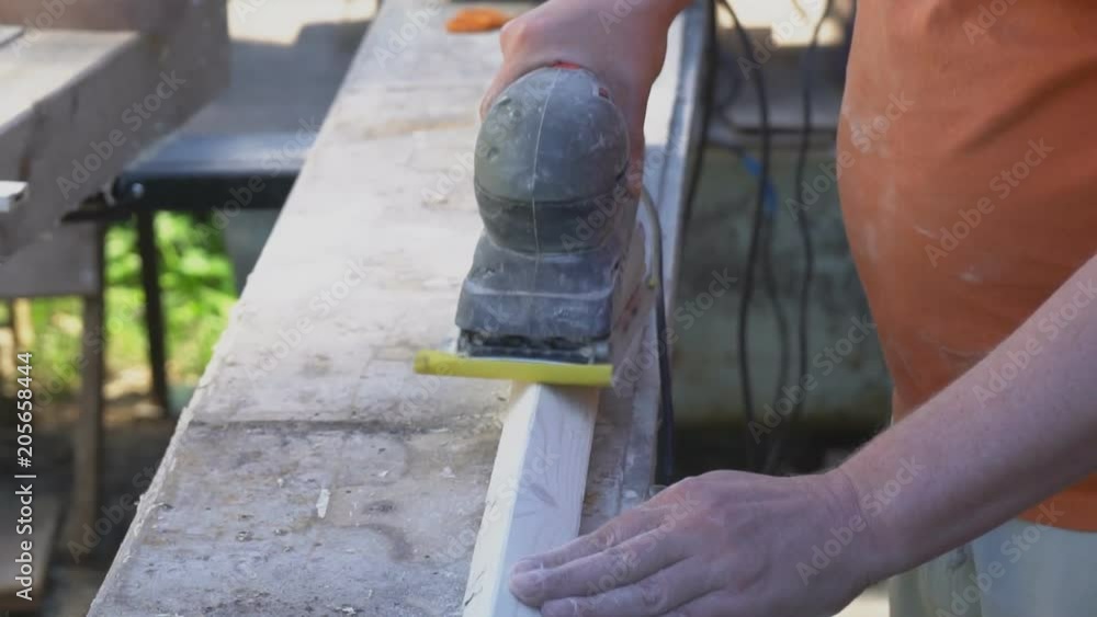 Handyman using polish machine outdoors. Handyman using polish machine outdoors.