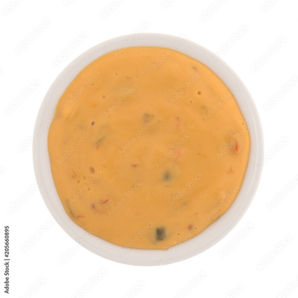 Top view of melted dipping cheese in a small bowl isolated on a white background. Top view of melted dipping cheese in a small bowl isolated on a white background.