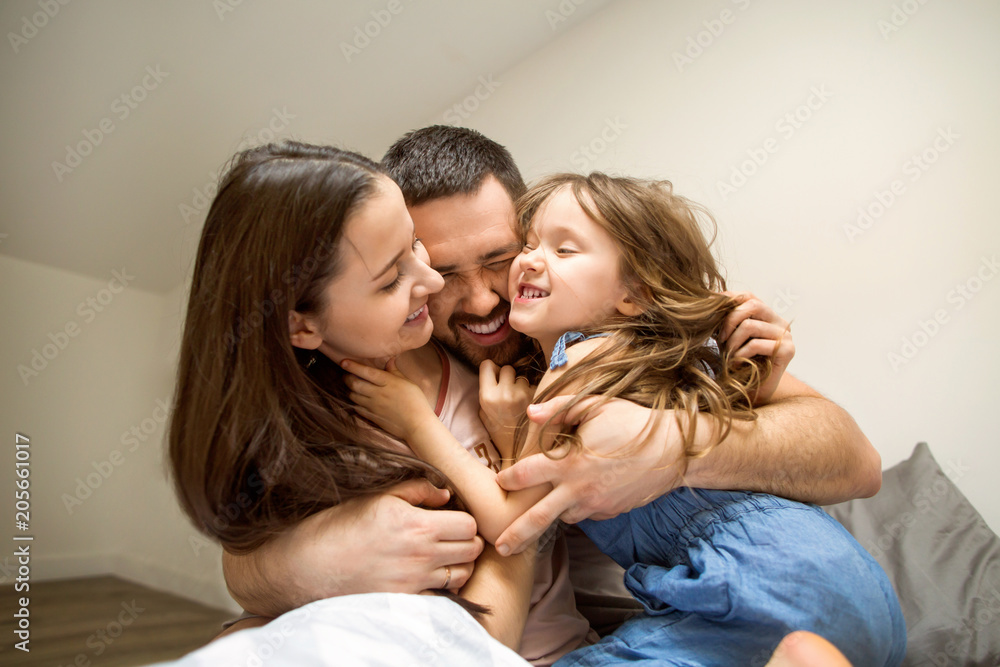 happy family at home in her room celebrating the fourth birthday of her daughter, concept of family relationsp happy family at home in her room celebrating the fourth birthday of her daughter, concept of family relationsp