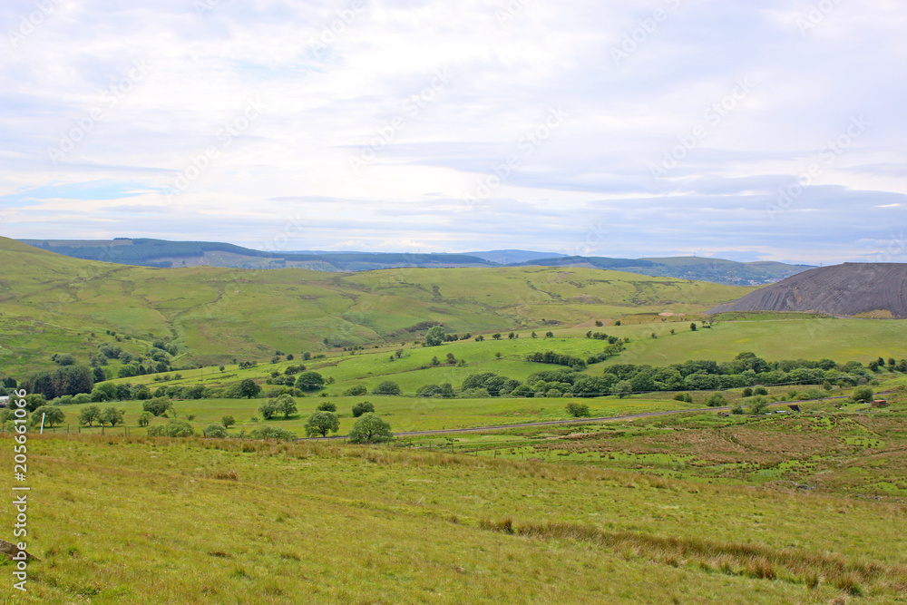 Welsh hills by a coal mine slag heap