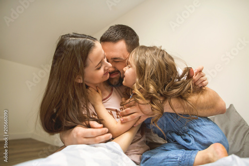 happy family at home in her room celebrating the fourth birthday of her daughter, concept of family relationships