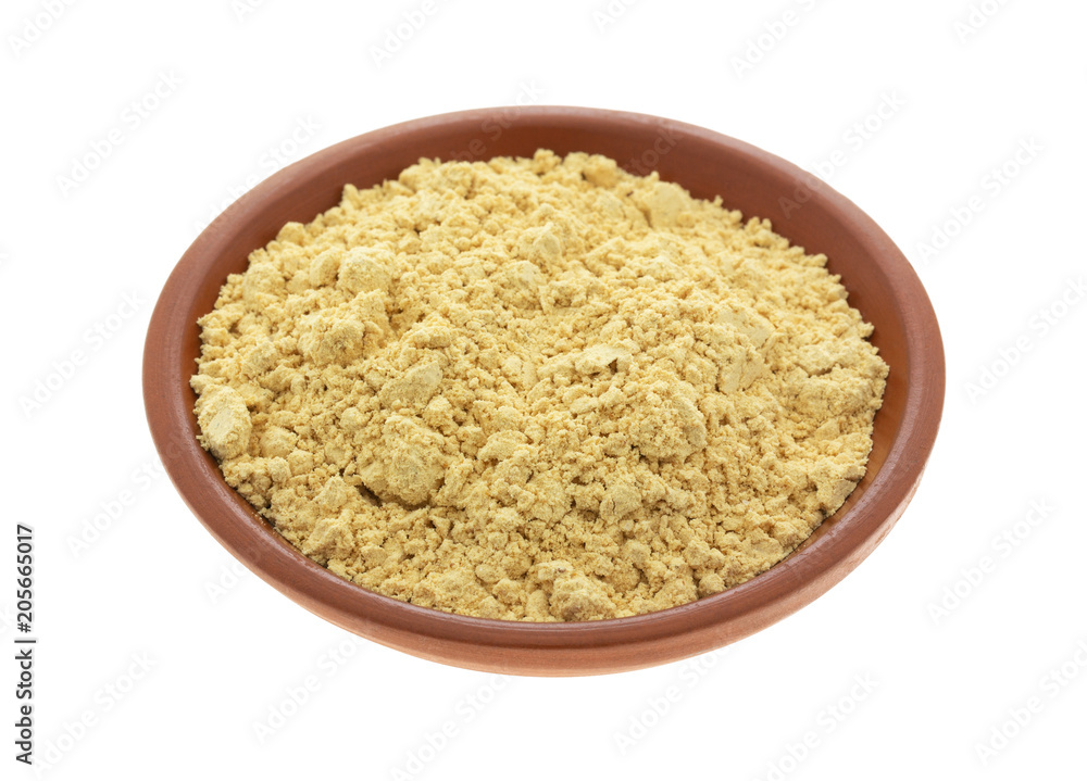 Peanut powder in a small bowl isolated on a white background. Peanut powder in a small bowl isolated on a white background.
