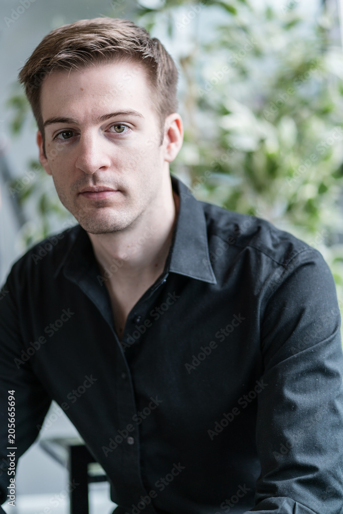 smart and handsome caucasian man in black shirt smart and handsome caucasian man in black shirt